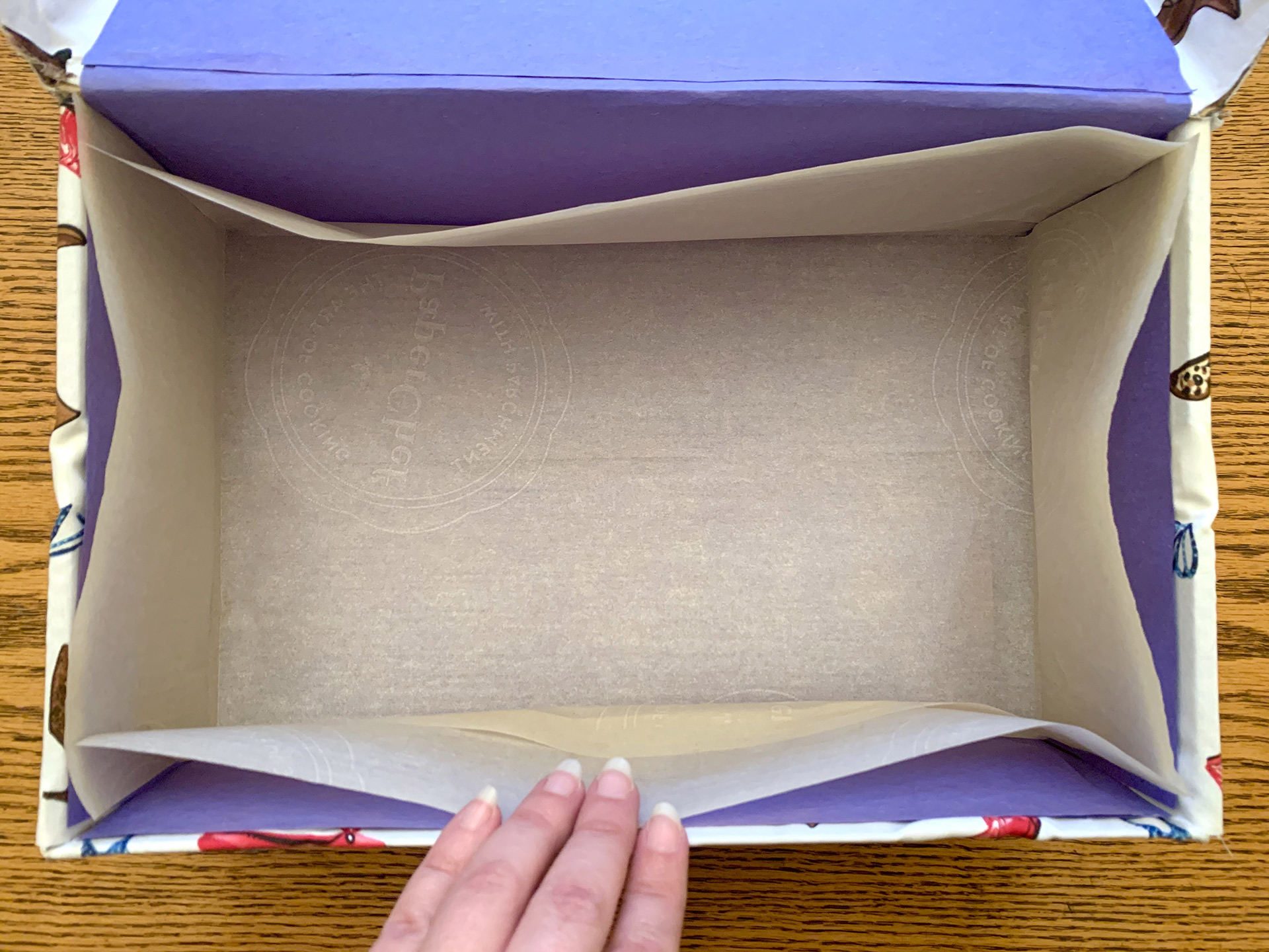 photo of the open box with parchment paper inside